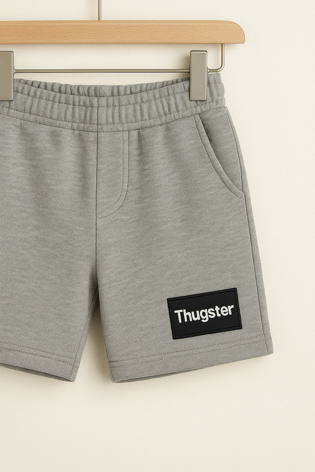 Gray shorts with elastic waistband and Thugster patch from urban kids clothing set